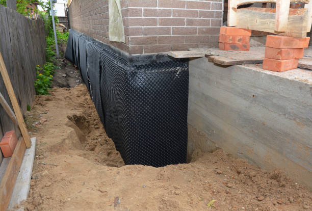 Happy homeowners after waterproofing job in Coshocton